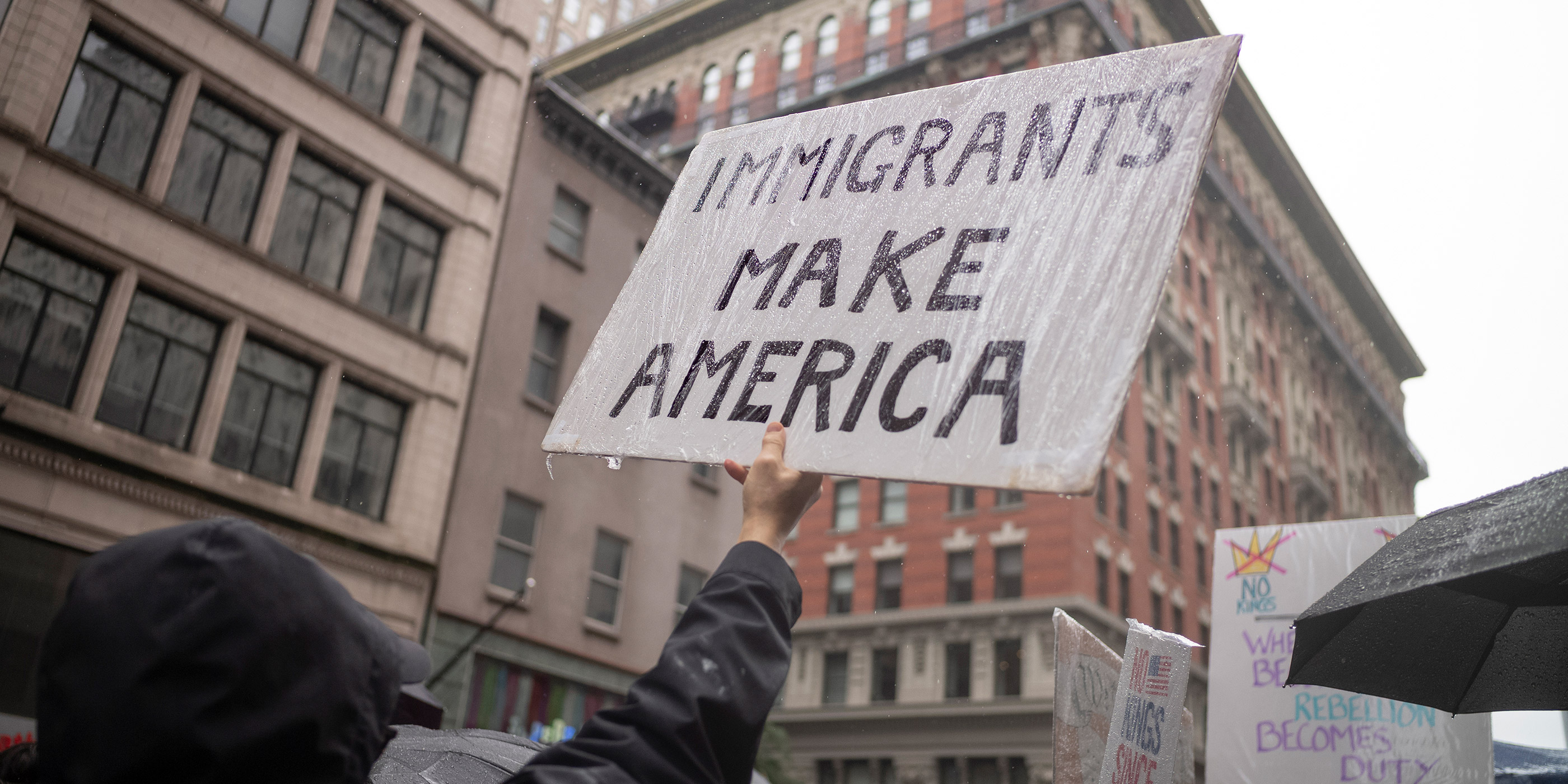 A protest sign from a No Kings rally that says "Immigrants Make America."