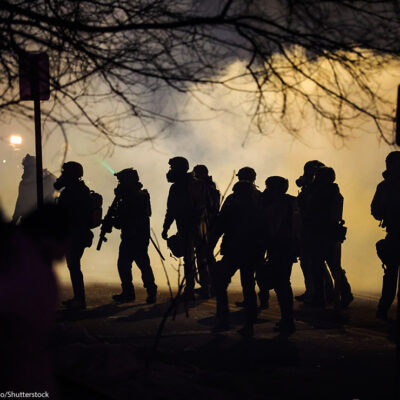 Federal law enforcement deploys gas at the site of a reported shooting in North Minneapolis.