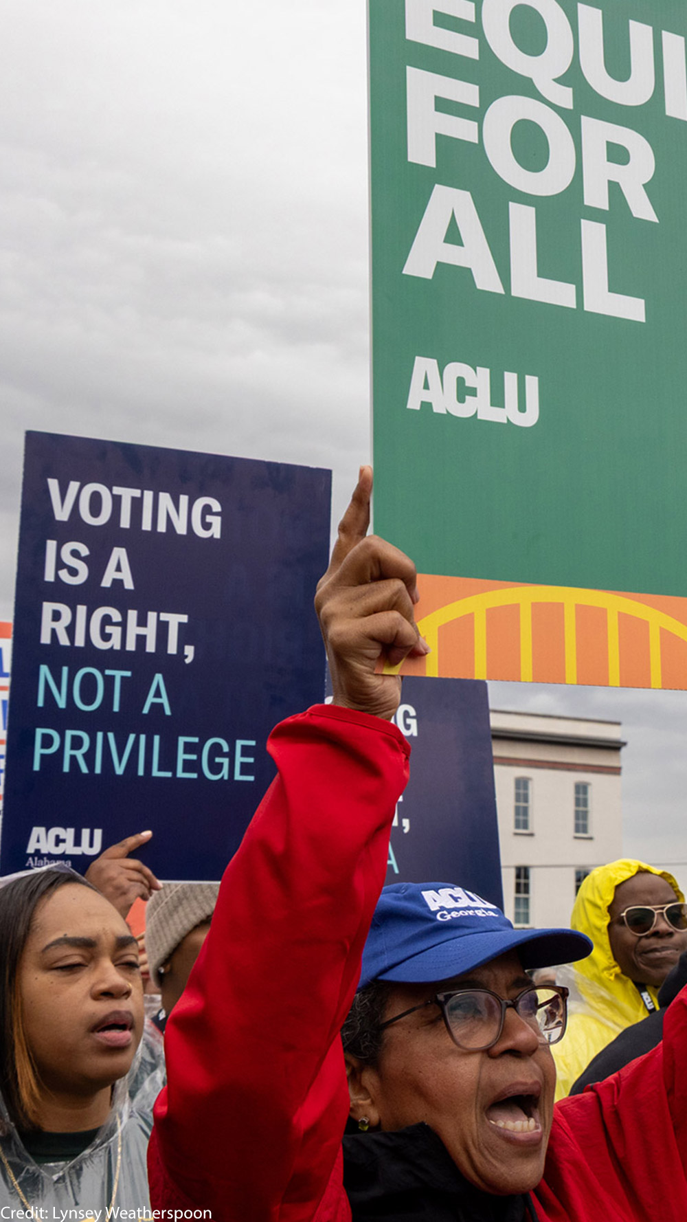 A group of voting rights advocates marching over the Edmund Pettus Bridge.